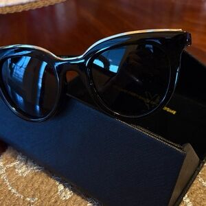 Black Round Sunglasses with Gold Accent Text